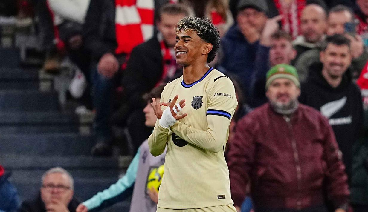 Di menit ke-68, Barcelona memecah kebuntuan setelah Lamine Yamal melepaskan tembakan melengkung dari sisi kanan dalam kotak penalti Athletic Bilbao dan berbuah menjadi gol. Barcelona unggul 0-1 atas tuan rumah. Tampak dalam foto, pemain Barcelona, Lamine Yamal merayakan golnya pada pertandingan pekan ke-27 La Liga 2025/2026 melawan Athletic Bilbao di Stadion San Mames, Sabtu 7 Maret 2026 waktu setempat atau Minggu (8/3/2026) dini hari WIB. (AP Photo/Miguel Oses)
