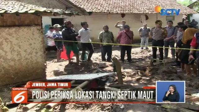 Polisi dan tim medis periksa septic tank yang merenggut nyawa satu keluarga di Jember, Jawa Timur.