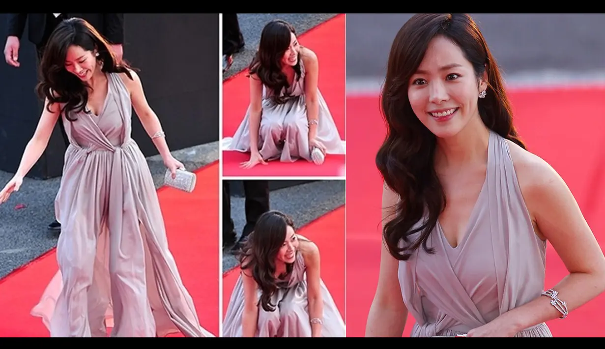 Aktris Han Ji Min akhirnya hanya dapat menahan tawa malunya ketika ia terjatuh di atas karpet merah saat menghadiri Korea Drama Awards 2012 pada tanggal 2 Oktober 2012 lalu (Istimewa)