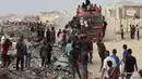 Juru bicara badan pertahanan sipil Gaza, Mahmud Bassal, pada Sabtu (21/6/2025), melaporkan sekitar 31 korban tewas di antaranya merupakan para pencari bantuan kemanusiaan di Gaza. (Omar AL-QATTAA/AFP)