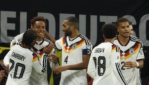 Timnas Jerman meraih kemenangan 6-0 atas Slovakia pada laga terakhir Grup A kualifikasi Piala Dunia 2026 zona Eropa di&nbsp;Red Bull Arena, Leipzig, Selasa (18/11/2025) dini hari WIB. Berkat hasil positif tersebut, Jerman kukuh di puncak Grup A dan memastikan diri lolos ke putaran final Piala Dunia tahun depan. (AFP/Odd ANDERSEN)