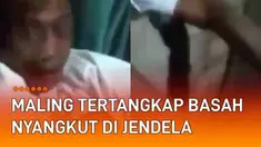 Beredar sebuah video seorang maling tertangkap basah nyangkut di jendela.
