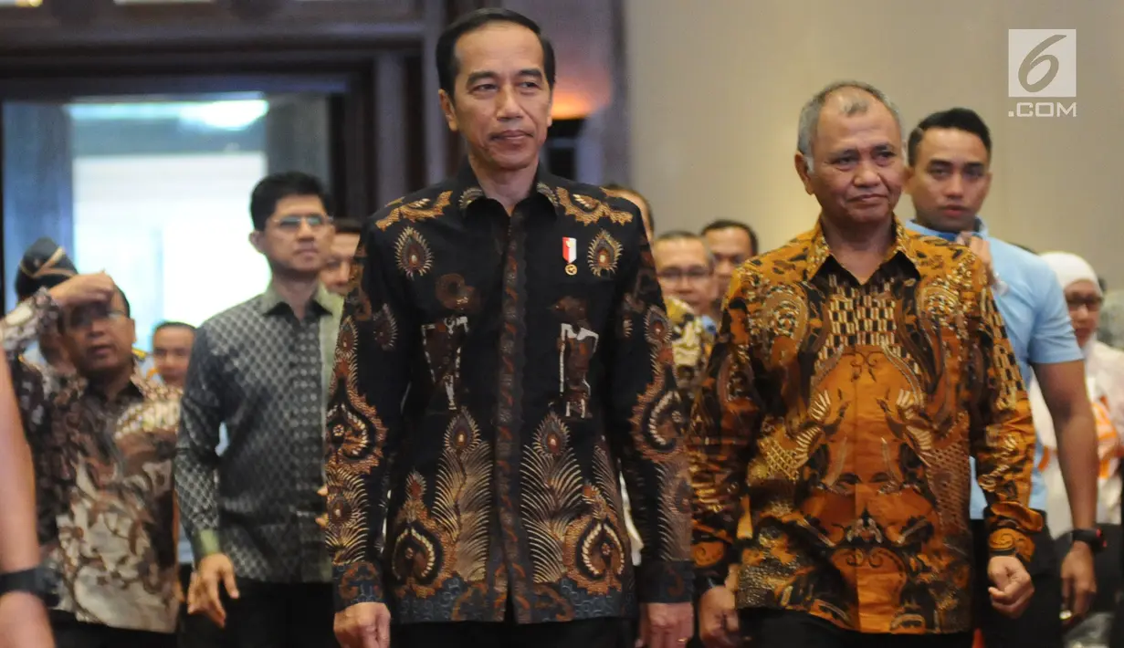 Presiden Joko Widodo (Jokowi) didampingi Ketua KPK Agus Rahardjo menghadiri Peringatan Hari Anti Korupsi Sedunia 2018 di Jakarta, Selasa (4/12). Acara ini mengambil tema Menuju Indonesia Bebas Dari Korupsi. (Liputan6.com/Angga Yuniar)