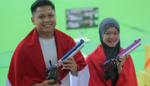 Prestasi gemilang dipersembahkan oleh duet M. Iqbal Raia Prabowo dan Arista Perdana Putri Darmoyo dari nomor Shooting 10 meter Air Pistol Mixed Team pada SEA Games 2025 Thailand. (Bola.com/Bagaskara Lazuardi)
