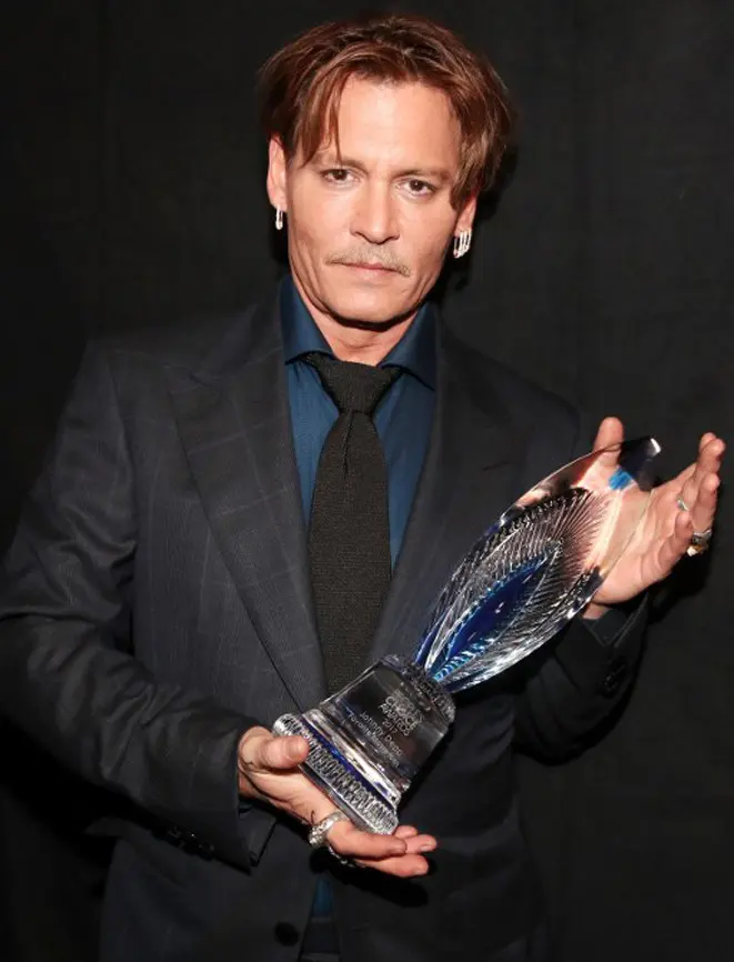 Perceraiannya dengan Amber Heard kabarnya telah mencapai titik akhir beberapa waktu lalu. Harta gono-gini yang menjadi hal Amber Heard juga telah dibayarkan oleh Depp. (AFP/Bintang.com)