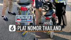 Beredar video polisi sedang menilang pengendara motor berplat Thailand. Kejadian ini terjadi di Kota Lampung.