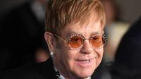 Elton John berusaha untuk bunuh diri dengan menghirup gas untuk kompor. (ANGELA WEISS / AFP)