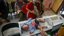 Program ini terbuka bagi seluruh kelompok usia, mulai dari bayi hingga lanjut usia. (JUNI KRISWANTO/AFP)