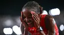 Atlet Bahrain Winfred Yavi bereaksi setelah memenangi final nomor 10.000 meter putri pada Asian Games 2026 di Nagoya City Mizuho Park Athletic Stadium, Nagoya, Prefektur Aichi, Jepang, Kamis (24/9/2026). (MOHD RASFAN / AFP)