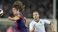Aksi kapten Barcelona Carles Puyol pada pertandingan La Liga melawan Valencia di Nou Camp pada 16 Oktober 2010. AFP PHOTO/JOSEP LAGO