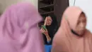 Hingga Rabu (1/10/2025) pagi, tiga santri telah dikonfirmasi meninggal dunia, puluhan lainnya mengalami luka-luka, dan sejumlah santri masih dalam upaya pencarian. (AP Photo/Trisnadi)