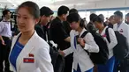 Atlet Korea Utara yang dikepalai Wakil Menteri Olahraga Korea Utara, Won Kil U bersiap meninggalkan bandara internasional Pyongyang, Korut (10/8). Korut akan berpartisipasi dalam Asian Games 2018 di Jakarta dan Palembang, Indonesia. (AP Photo/Cha Song Ho)