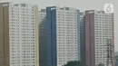 Deretan gedung hunian vertikal di Jakarta, Minggu (15/12/2019). Kementerian Pekerjaan Umum dan Perumahan Rakyat (PUPR) berencana menyiapkan hunian berbiaya murah di pusat kota bagi kaum milenial dengan konsep berupa bangunan vertikal. (merdeka.com/Iqbal Nugroho)