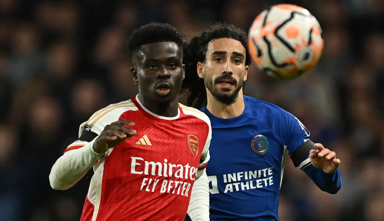 Derby London antara Chelsea vs Arsenal ini berakhir dengan skor imbang 2-2. (JUSTIN TALLIS / AFP)