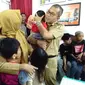 Tiga bocah korban penyekapan ibu asuhnya kini merasa riang dan gembira (Liputan6.com/ Eka hakim)