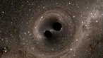 Lubang hitam saling mendekat terdeteksi oleh Laser Interferometer Gravitational -Wave Observatory  (LIGO) dengan menggunakan simulasi gambar komputer, Washington, (11/2).Gambar tersebut menujukkan bahwa adanya gelombang gravitasi. (REUTERS / Caltech)