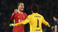 Berstatus tim tamu, Liverpool sukses mengalahkan tuan rumah Paris Saint-Germain (PSG) dengan skor tipis 1-0. (Anne-Christine POUJOULAT/AFP)