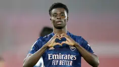 Pemain Arsenal, Bukayo Saka, melakukan selebrasi usai mencetak gol ke gawang Southampton pada laga Liga Inggris di Stadion St Mary, Selasa (26/1/2021). Arsenal menang dengan skor 3-1. (AP/Frank Augstein, Pool)