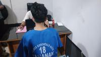 Pelaku kriminal Danial saat diamankan Satreskim Polresta Gorontalo Kota (Arfandi Ibrahim/Liputan6.com)