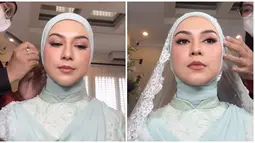 Bulu mata palsu dan eye makeup warna pink dengan glitter membuat penampilan Irish Bella memukau. Lipstik cokelat glossy dan blush on natural senada juga menambah kesan elegan Irish Bella di pernikahannya. Meski merupakan pernikahan keduanya, namun Irish Bella tetap merasakan ketegangan dipersunting oleh pria pilihannya yang merupakan seorang duda dengan dua anak. (Liputan6.com/IG/@rarachintya.mua)