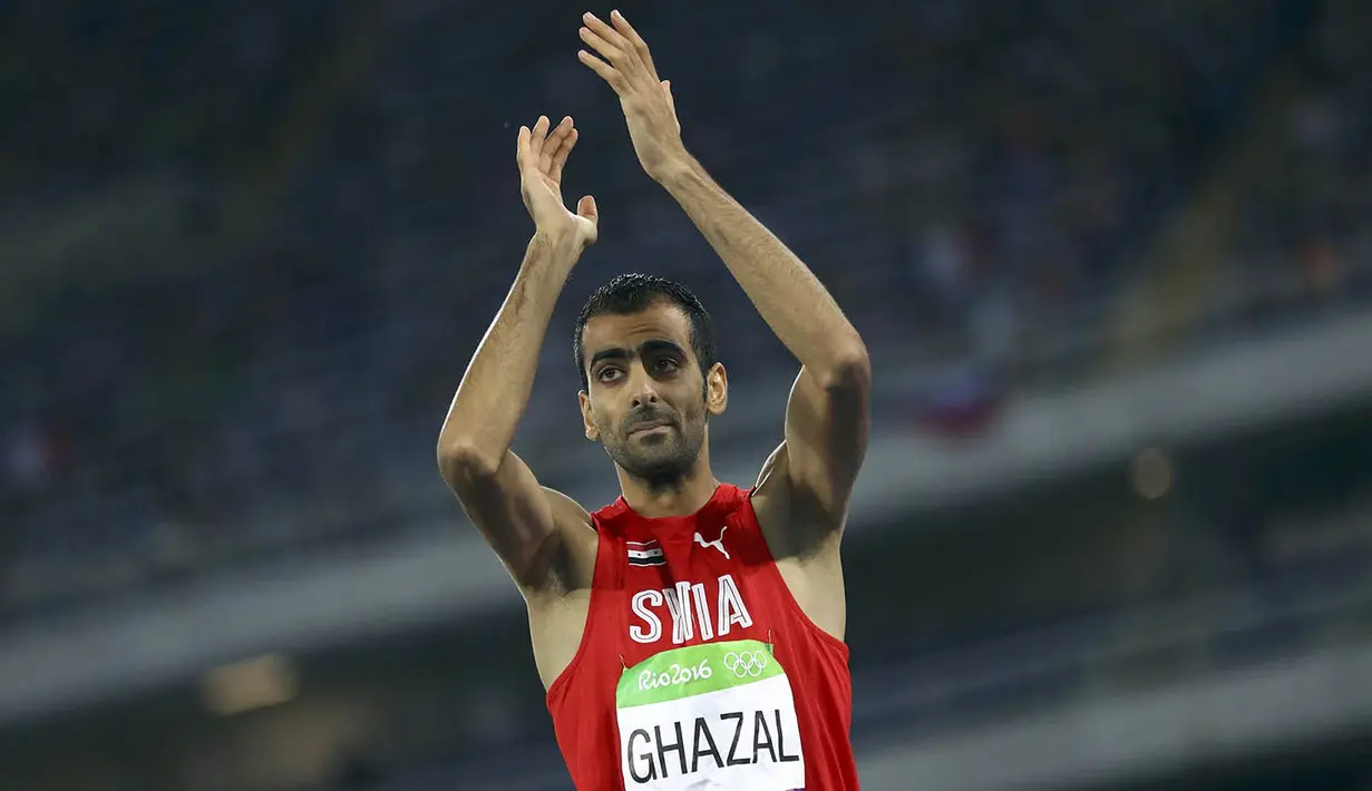 Atlet lompat tinggi Suriah, Majd Eddin Ghazal, usai melakukan lompatan pada Olimpiade 2016. Meski gagal meraih medali dirinya mampu melakukan lompatan mencapai 2,29m hanya beda 0,09m dari peraih medali emas. (Reuters/Kai Pfaffenbach)