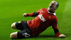 Manchester United's English forward Wayne Rooney scores a penalty during their UEFA Champions League Group C football game at Ibrox in Glasgow, Scotland, on November 24, 2010. AFP PHOTO/Paul ELLIS