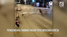 Rekaman pengendara motor menabrak pagar perlintasan kereta.