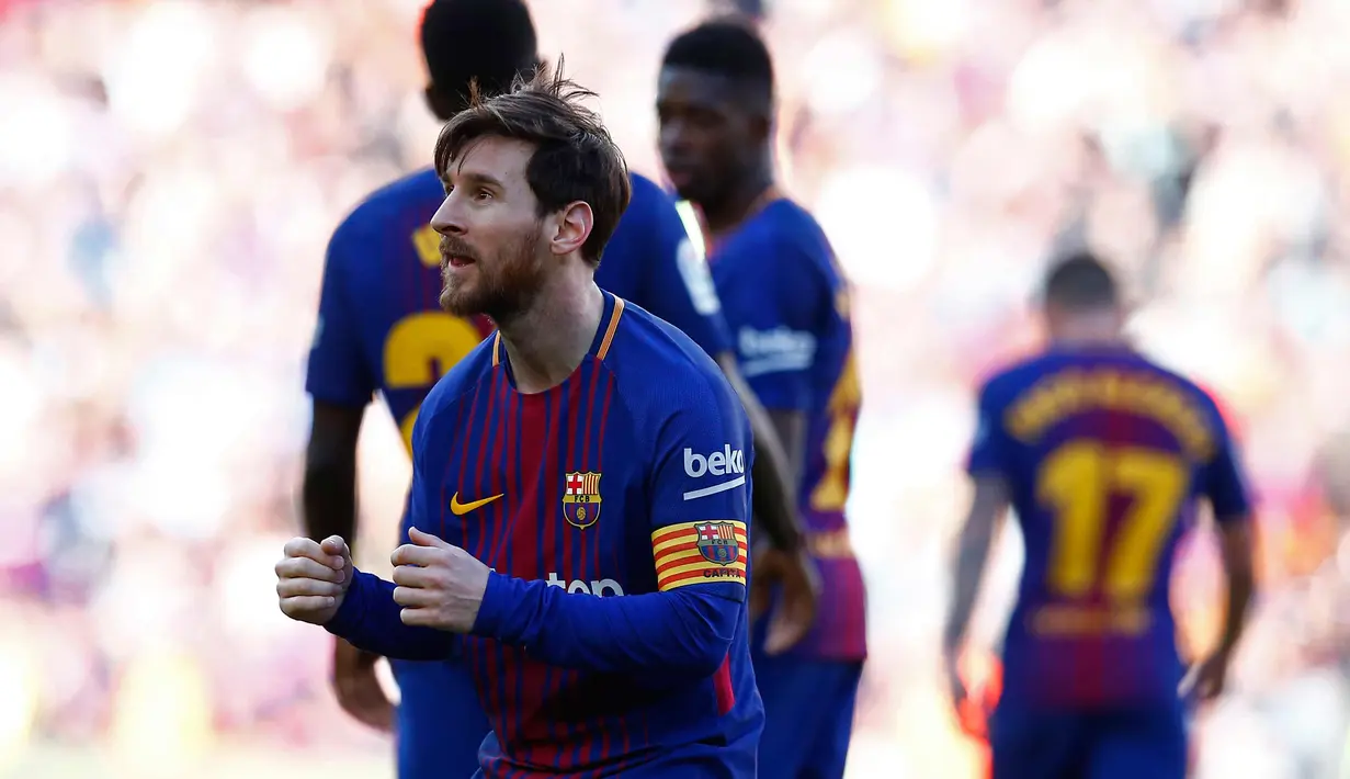 Penyerang Barcelona, Lionel Messi melakukan selebrasi usai mencetak gol ke gawang Athletic Bilbao di stadion Camp Nou, Spanyol (18/3). Messi berjoget usai mencetak gol dan membawa timnya menang 2-0. (AP Photo / Manu Fernandez)