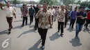 Menteri Pertanian, Amran Sulaiman tiba untuk meninjau pasar murah beras dan sapi di Gudang Bulog, Jakarta, Selasa (22/9/2015). Sebanyak 30 truk beras dan sapi didistribusikan ke sejumlah pasar tradisional DKI. (Liputan6.com/Faizal Fanani)