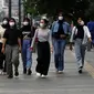 Tapi, pemerintah tetap menganjurkan masyarakat untuk menggunakan masker jika merasa dalam keadaan sehat dan untuk melindungi diri. (Liputan6.com/Helmi Fithriansyah)