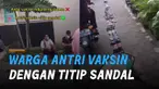 Cara unik dan kreatif sekumpulan warga saat antri Vaksinasi Covid-19 dengan menggunakan sandal.