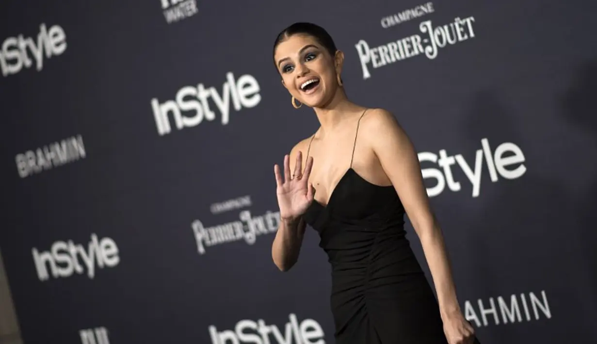 Selena Gomez sepertinya saat ini merasa bahwa hubungannya dengan Justin Bieber akan berakhir bahagia. Kalau menurut kamu gimana? (VALERIE MACON / AFP)