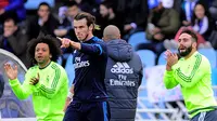 Real Madrid meraih kemenangan 1-0 atas Real Sociedad dalam laga pekan ke-36 La Liga Spanyol di Stadion Anoeta, Sabtu (30/4/2016) malam WIB. Gol tunggal Los Blancos dicetak Gareth Bale pada menit ke-80. (AFP/Ander Gillenea)