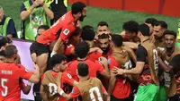 Pemain Timnas Mesir merayakan gol yang dicetak Mohamed Salah dalam laga kontra Selandaia Baru di Grup G Piala Dunia 2026 yang berlangsung di BC Place, Vancouver, Kanada, Senin (22/6/2026) pagi WIB. (Alex Grimm/Getty Images/AFP)