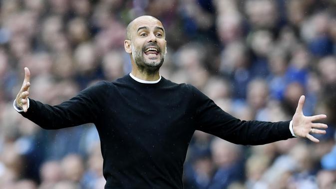 Pep Guardiola - Pelatih Manchester City. (AFP/Paul Ellis)