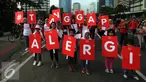 Ibu dan anak saat mengikuti pawai mengkampanyekan Bunda Tanggap Alergi dengan 3K kenali, konsultasikan, dan kendalikan di sekitar Bundaran HI, Jakarta, Minggu (17/4/2016). (Liputan6.com/Johan Tallo)