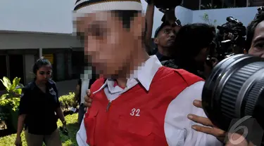  Salah satu pelaku dari kasus pelecehan seksual JIS tampak menuju ruang sidang, Jakarta, Rabu (27/8/2014) (Liputan6.com/Johan Tallo)