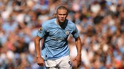 Ekspresi pemain Manchester City, Erling Haaland, saat melawan Fulham dalam pertandingan pekan keempat Liga Inggris 2023/2024 yang berlangsung di Etihad Stadium, Sabtu (2/9/2023). Tiga gol yang dicetak ke gawang Fulham membuat dirinya kokoh di puncak daftar pencetak gol terbanyak sementara musim ini dengan enam gol. (AFP/Oli Scarff)