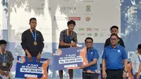 Robi Sianturi keluar sebagai juara 1 nasional Tangerang 10K dalam kategori pria.(Liputan6.com/Pramita Tristiawati)