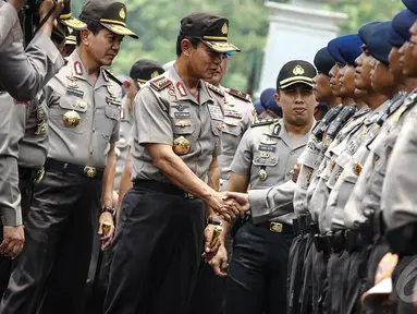 Kapolri Jenderal Pol Sutarman saat mengahadiri apel pengamanan pelantikan presiden dan wakil presiden di halaman Monumen Nasional, Jakarta, Jumat (17/10/2014) (Liputan6.com/Faizal Fanani)
