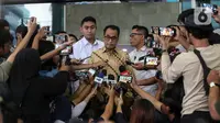 Menteri Perhubungan (Menhub) Budi Karya Sumadi (tengah) menjawab pertanyaan wartawan usai menjalani pemeriksaan di Gedung KPK C1, Jakarta, Rabu (26/7/2023). (Liputan6.com/Johan Tallo)