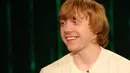 Rupert Grint pun merasa tak masalah menjadi selebriti. Ia menyukai hal tersebut karena bisa membuat orang lain bahagia. (BRYAN BEDDER / GETTY IMAGES NORTH AMERICA / AFP)