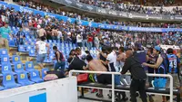 Kericuhan berdarah mewarnai jalannya Liga Meksiko yang mempertemukan Queretaro vs Atlas, Sabtu waktu setempat (5/3/2022), Jumlah korban jiwa masih simpang siur. (AFP/Eduardo Gomez)