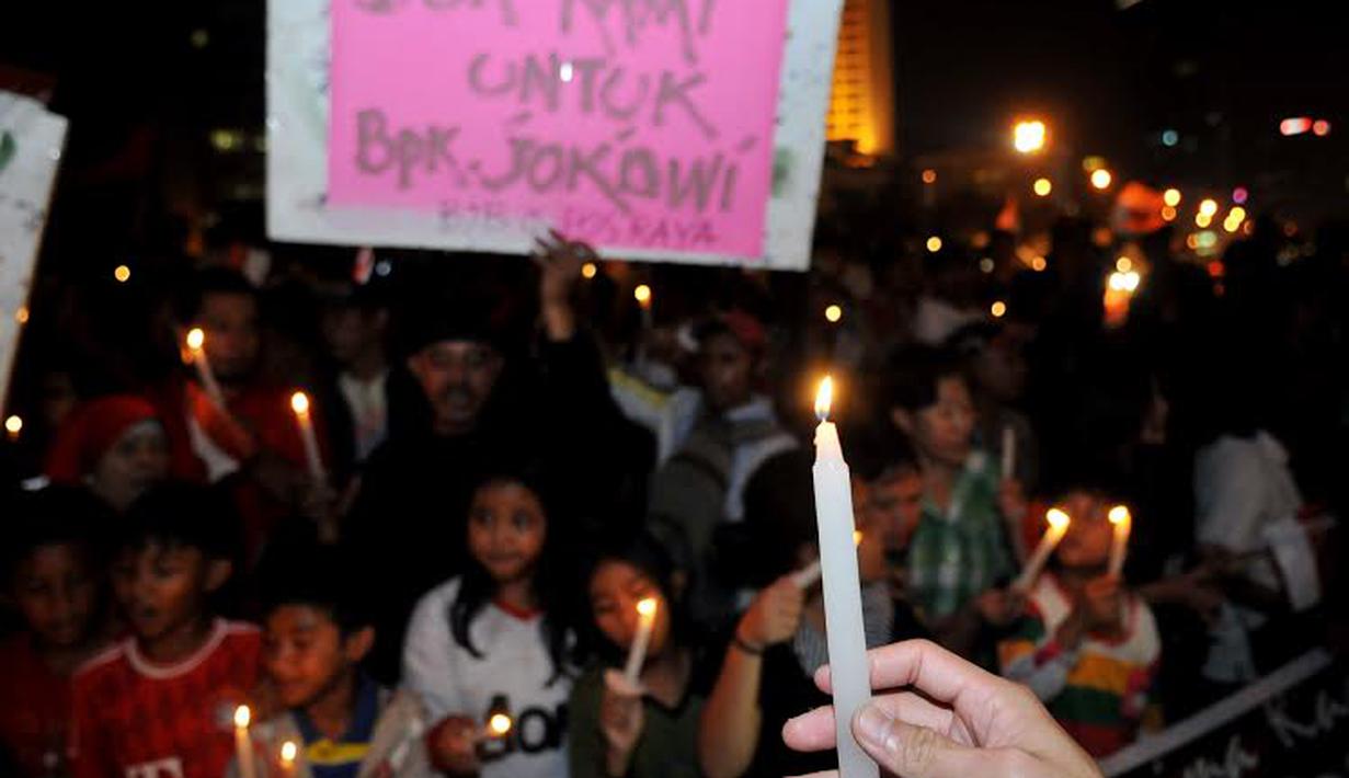 Ratusan orang pendukung Jokowi berkumpul di Bundaran HI, Jakarta untuk merayakan pencalonan mantan Walikota Solo itu sebagai Kandidat Presiden dalam Pemilu mendatang (Liputan6.com/Johan Tallo)