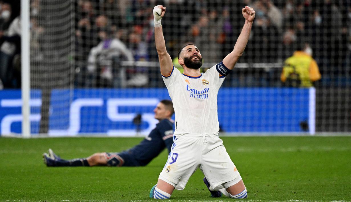 Real Madrid melakukan epic comeback saat mendepak Paris Saint-Germain (PSG) pada 16 besar Liga Champions 2021/2022. (AFP/Gabriel Bouys)