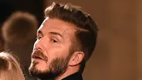 3. David Beckham, mantan bintang Inggris ini memang terkenal sebagai salah satu pesepak bola yang memiliki gaya stylish. Mantan gelandang MU ini kerap memiliki gaya rambut yang menjadi trendsetter. (AFP/Jewel Samad)