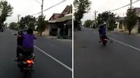 Seorang anak kecil terlihat bergaya freestyle sambil mengendarai motor