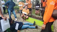 Rekonstruksi pengeroyokan remaja di Hutan Kota Jalan Jenderal Sudirman, Kecamatan Tanah Grogot Kabupaten Paser, Rabu (7/9/2022). (Liputan6.com)