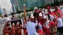Aksi simpatik relawan Jokowi-Jusuf Kalla di Bundaran HI Jakarta, (17/10/14). (Liputan6.com/Johan Tallo)