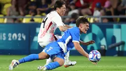 Jepang akhirnya memastikan diri menjadi pemuncak klasemen grup D usai menang 1-0 atas Israel. (ROMAIN PERROCHEAU / AFP)